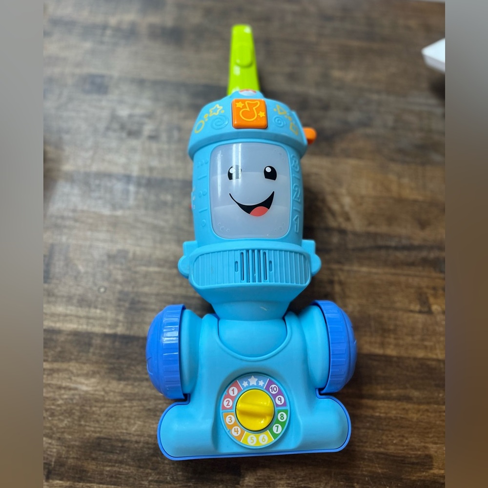 Fisher-Price Laugh & Learn Light-Up Learning Vacuum.